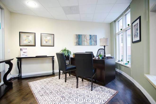 Executive office with desk and visitor seating